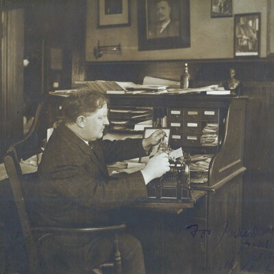 William Allen White at his messy desk