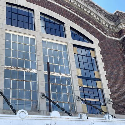 Window renovation is underway. The black window frames have new panes, glazing, paint and plaster.