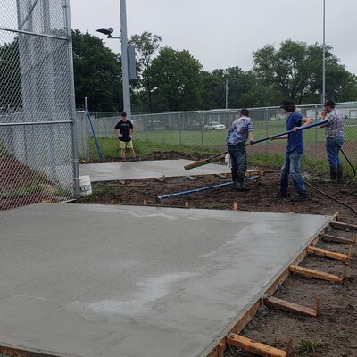 HS & Community Volunteers building concrete pads