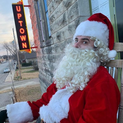 Great shot of Santa and the neon sign!